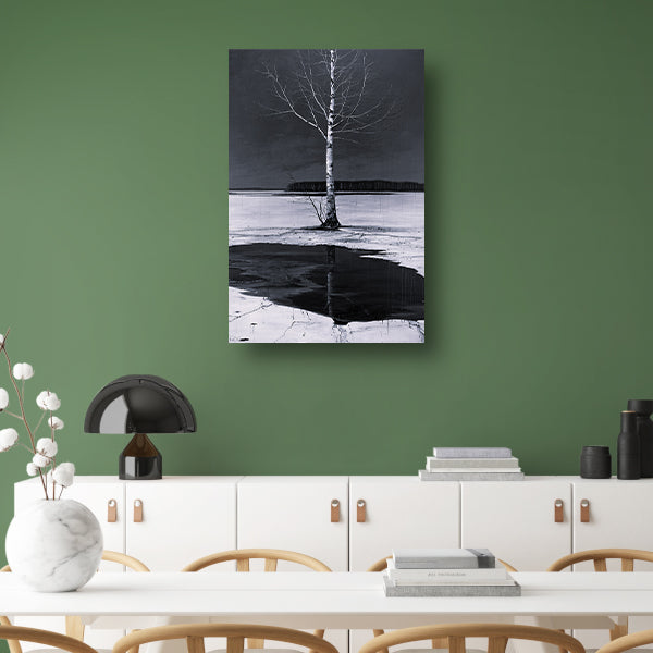 Eenzame boom bij bevroren meer canvas