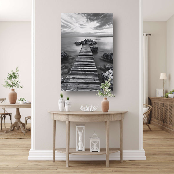 Houten steiger bij zee tijdens bewolkte zonsopkomst canvas