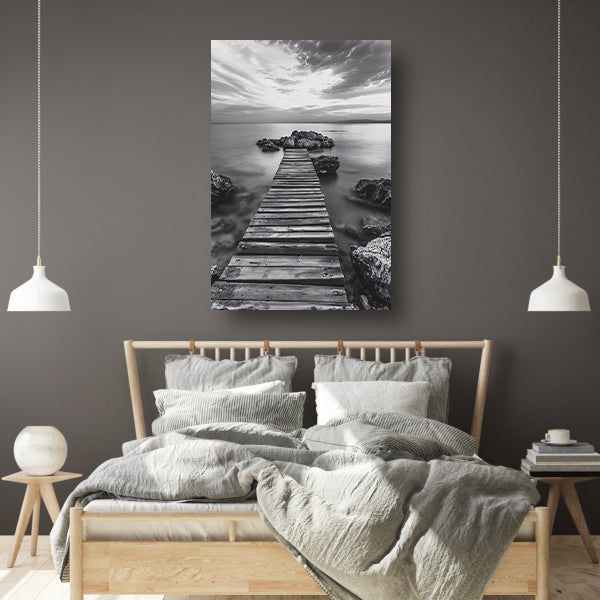Houten steiger bij zee tijdens bewolkte zonsopkomst canvas