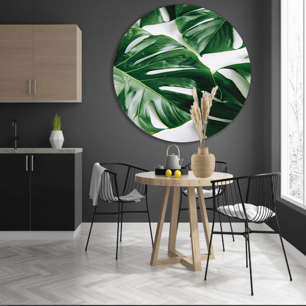 Elegante Monstera bladeren op helderwitte achtergrond aluminium muurcirkel