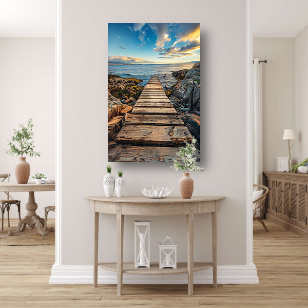 Houten pier bij zonsondergang met dramatische wolken canvas