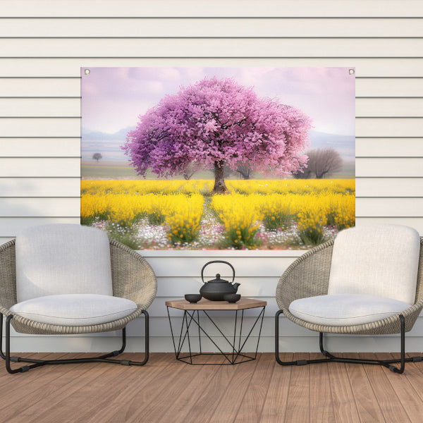 Bloeiende boom in kleurrijk bloemenveld tuinposter