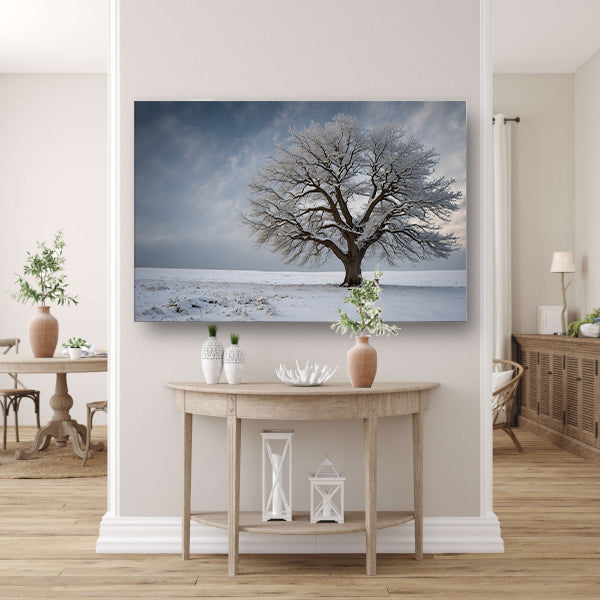 Een eenzame boom in de sneeuw canvas