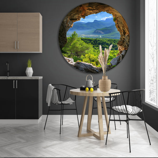 Berglandschap gezien vanuit een grot aluminium muurcirkel