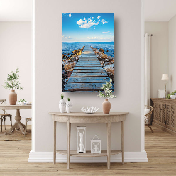 Houten steiger leidt naar serene blauwe zee canvas met baklijst
