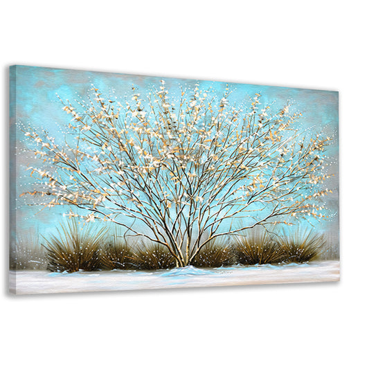 Sierlijke boom met sneeuw tegen blauwe lucht canvas