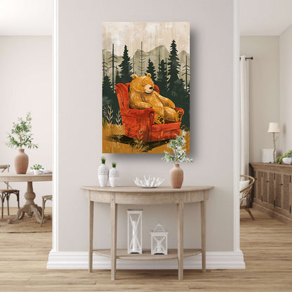 Bruine beer in rode fauteuil in bos poster