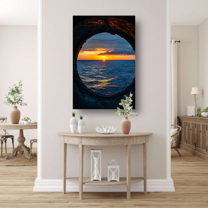Zeezicht bij zonsondergang door patrijspoort canvas