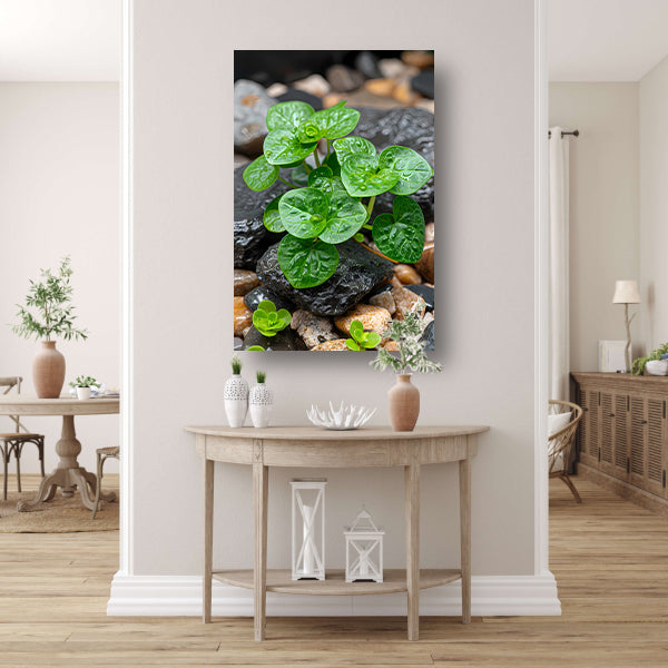 Jonge groene plant tussen stenen canvas met baklijst