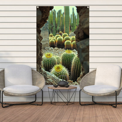Cactussen in bloei achter rotsformatie tuinposter