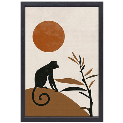 Zwart silhouet van aap tegen grote oranje zon canvas met baklijst
