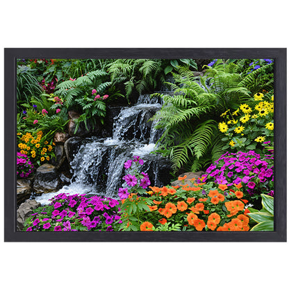 Waterval in kleurrijke bloementuin canvas met baklijst