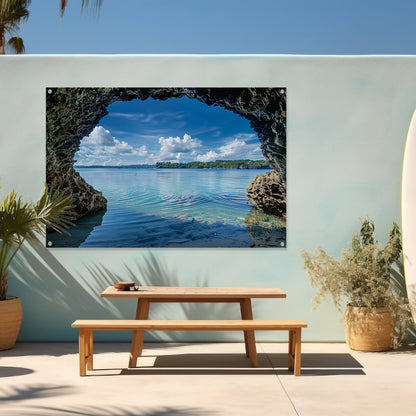 Zeezicht vanuit een grot met turquoise water tuinposter