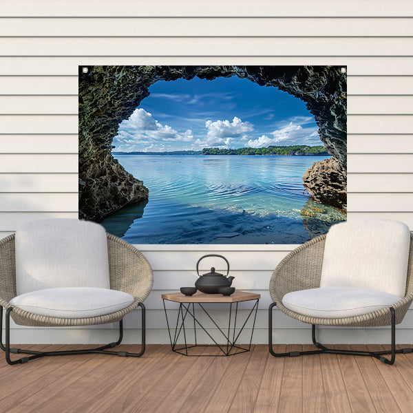 Zeezicht vanuit een grot met turquoise water tuinposter